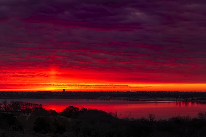 Amazing crimsonred sunrise over Benbrook Lake in Fort worth