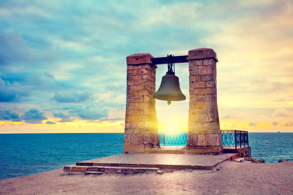 Ancient bell at sunset