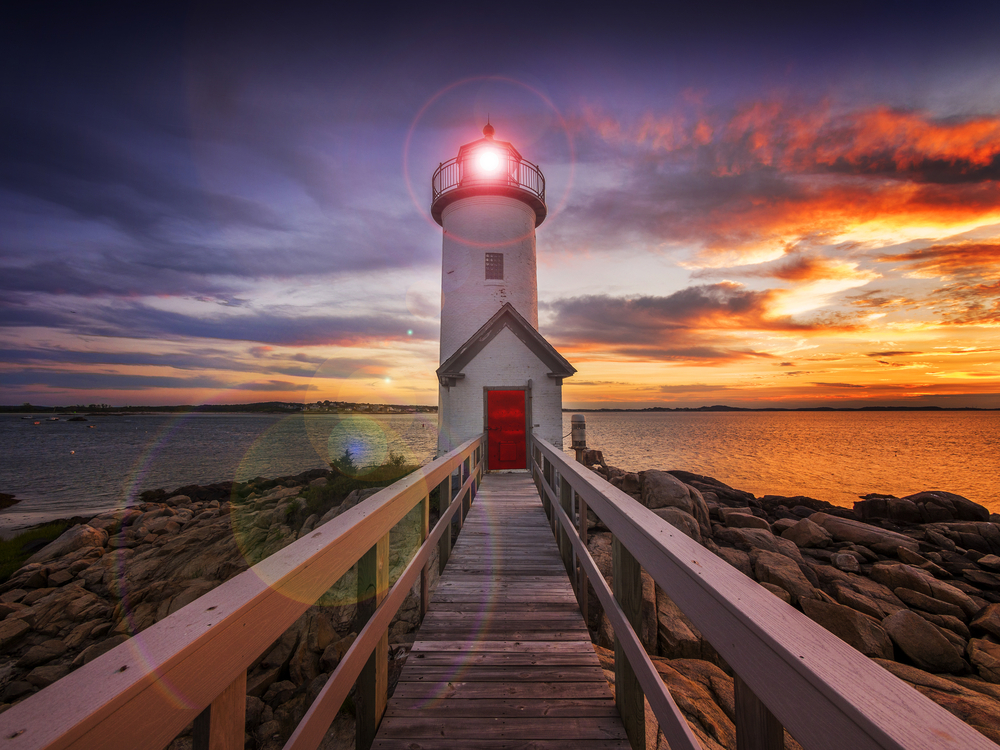 Annisquam lighthouse at sunset off the coast of Gloucester MA