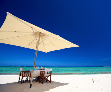 Breakfast on tropical white sand beach in Mauritius Island 