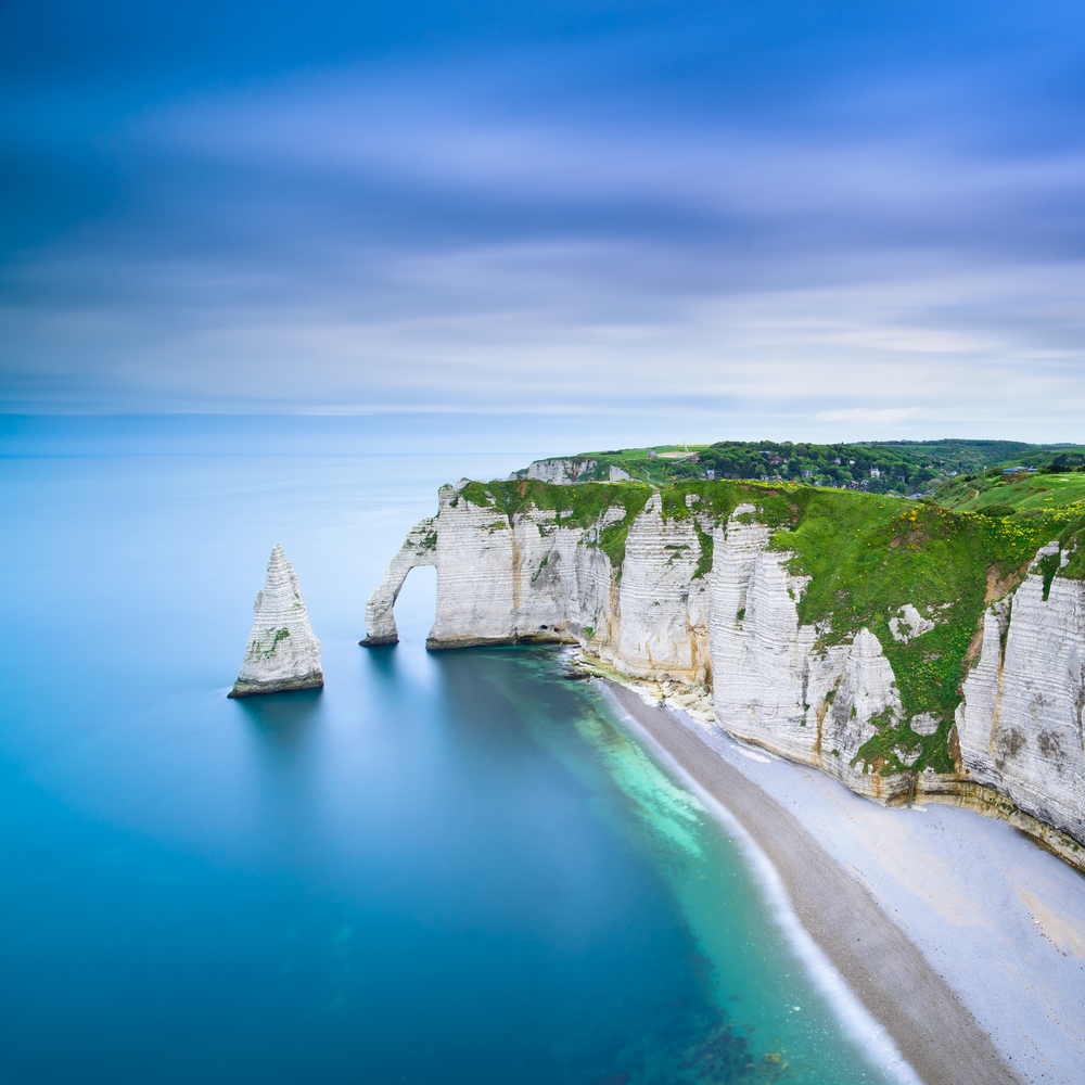 Etretat Aval cliff 9rocks and natural arch landmark and blue ocean