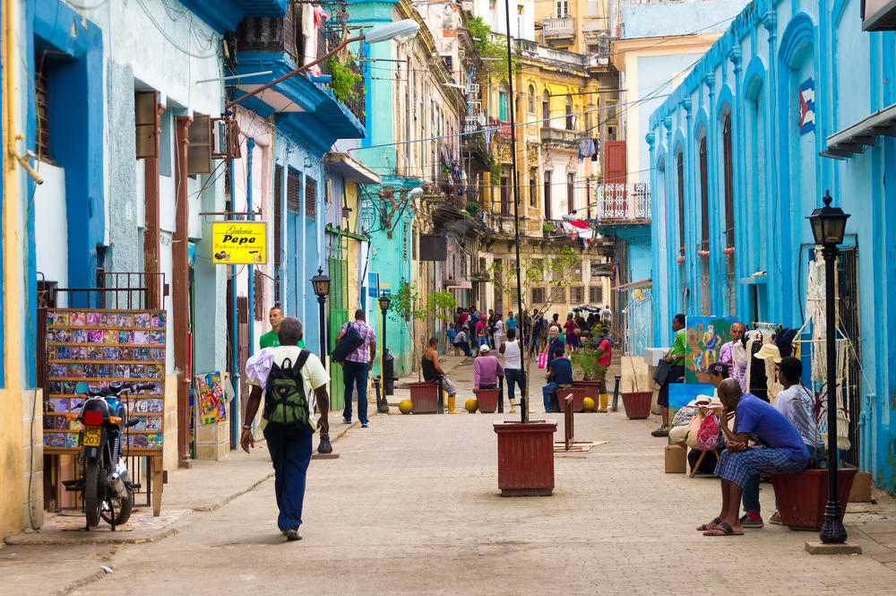 HAVANA DECEMBER 14 Street scene with cuban people and colorful old buildings December 142012 in Havana