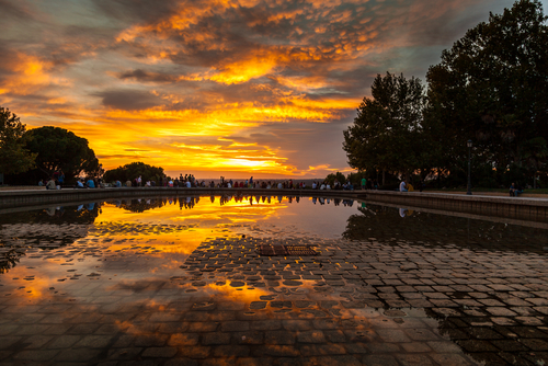 MADRID SPAIN OCTOBER 18 People admiring the sunset in Temple of Debod Park on October 18 2013 in Madrid
