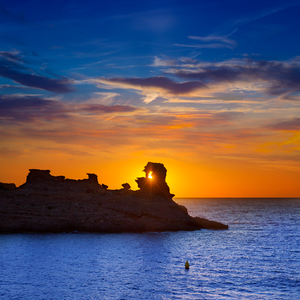 Menorca sunset in Cala Morell at Ses torretes beach Balearic Islands 