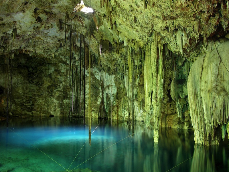 Mexican cenote with cyan water 