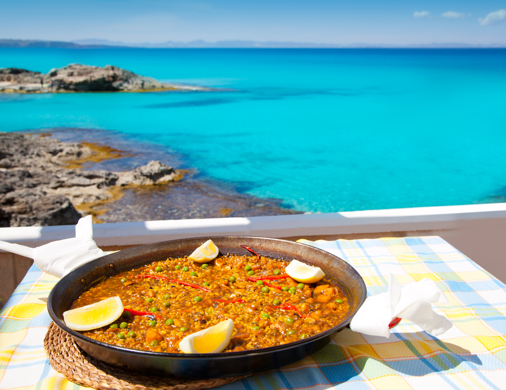 Paella mediterranean rice food by the Balearic Formentera island beach photo illustration 