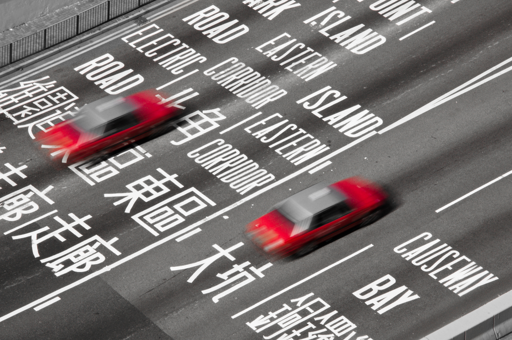 Red Hong Kong Taxis on a busy interchange in Causeway Bay