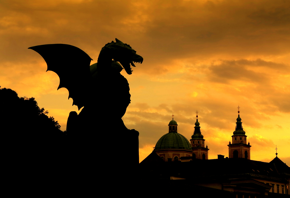 Sunset scene of Green Dragon on the Dragon Bridge in capital city Ljubljana Slovenia