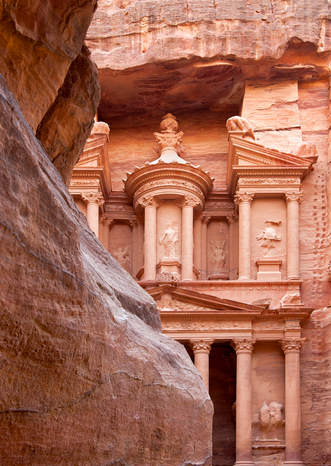 The first glimpse of the ancient Treasury el Khazneh from the al Siq gorge Petra Jordan