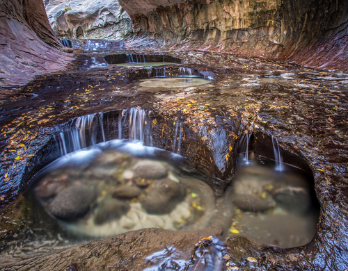 The very scenic Subway slot canyon with its cascading pools in Zion National Park Utah