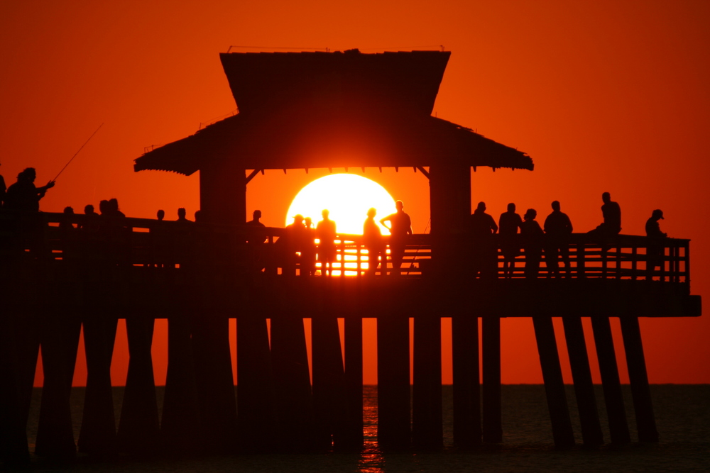 sunset at the pier in Naples Florida soft focus